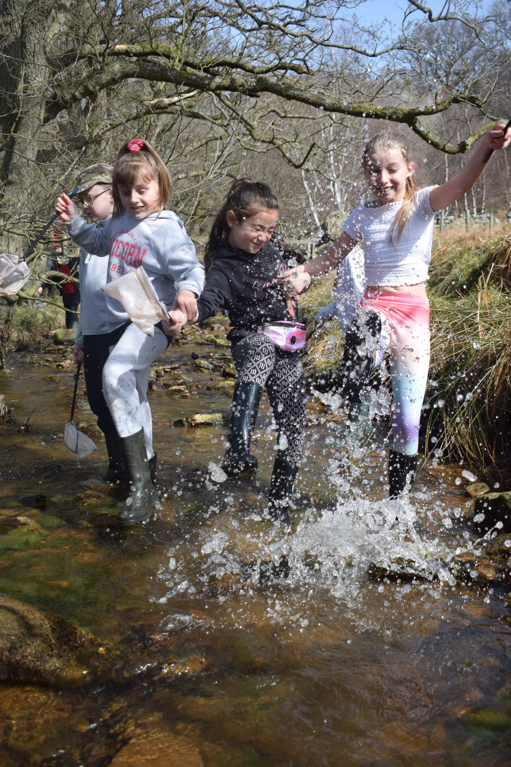 kids splashing in river